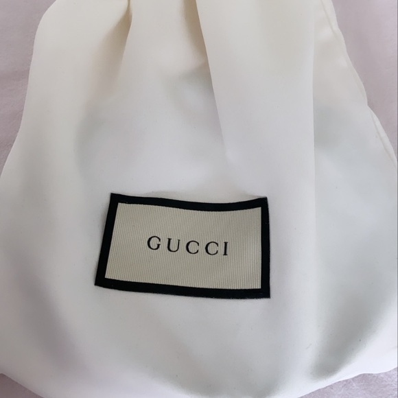 Pink Gucci belt with interlocking G buckle.